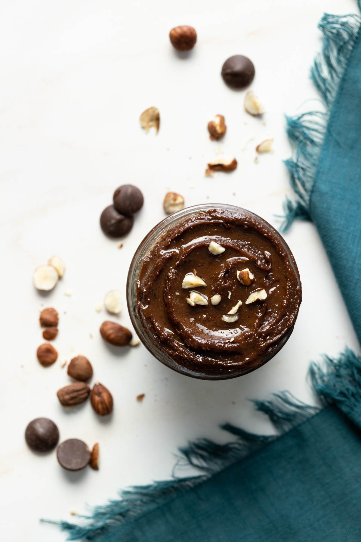 Avocado nutella with hazelnuts and blue linen napkin