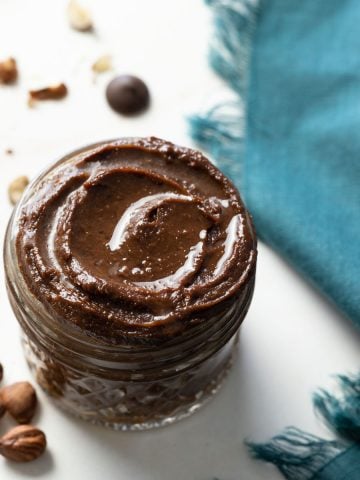 Avocado nutella in a jar with a linen napkin