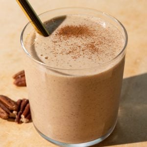 Close up of Banana bread smoothie on a yellow background