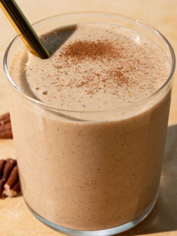 Close up of Banana bread smoothie on a yellow background