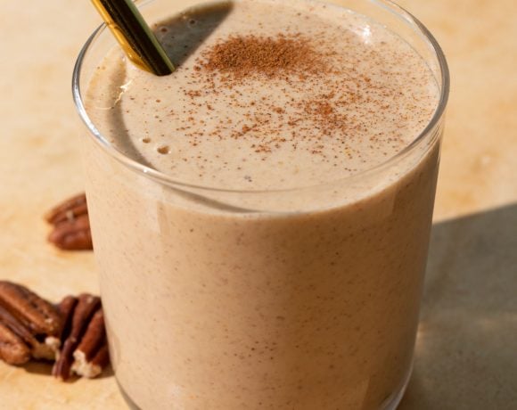 Close up of Banana bread smoothie on a yellow background