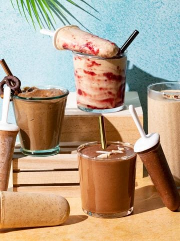 Chocolate and peanut butter smoothies in glasses and popsicles