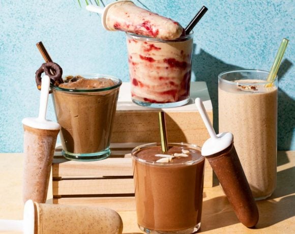 Chocolate and peanut butter smoothies in glasses and popsicles