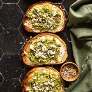 Avocado toasts with goat cheese and a bowl of bagel seasoning