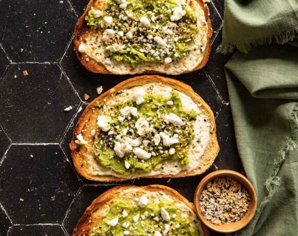 Avocado toasts with goat cheese and a bowl of bagel seasoning