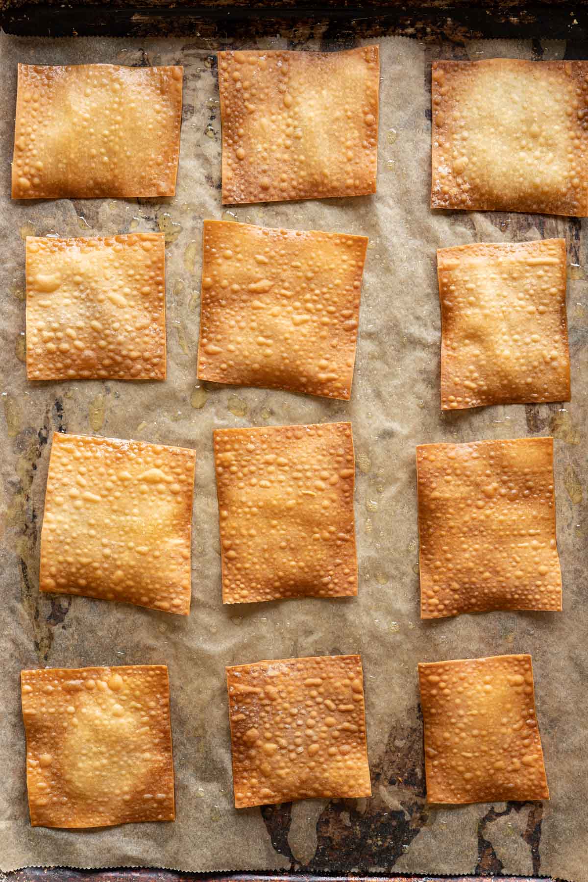 Baked wonton skins on a sheet pan