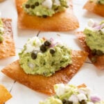 Goat cheese guacamole on top of a crispy wonton skins