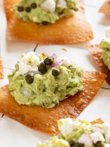 Goat cheese guacamole on top of a crispy wonton skins