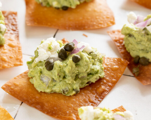 Goat cheese guacamole on top of a crispy wonton skins