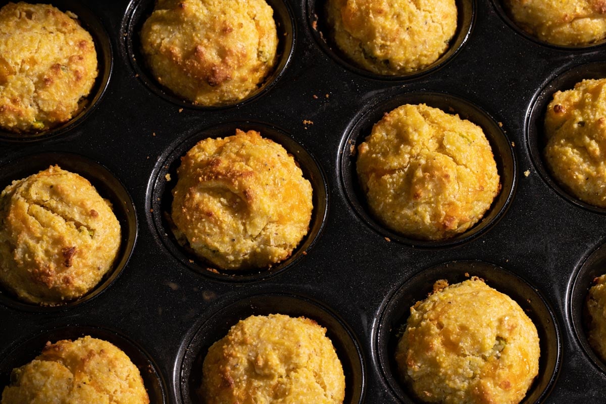 Jalapeno cheddar cornbread muffins in a muffin pan