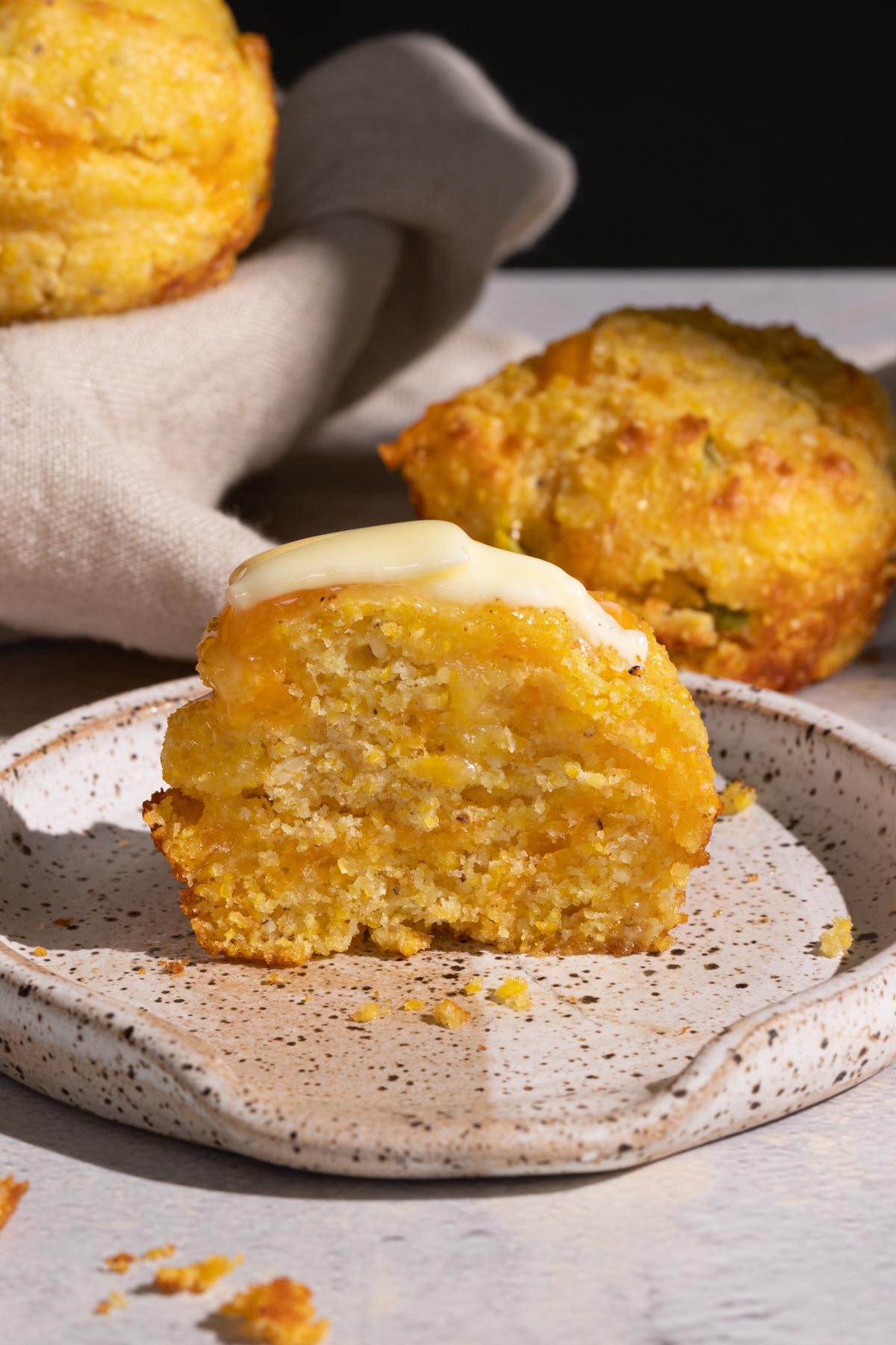 Jalapeno cheddar cornbread muffin on a plate