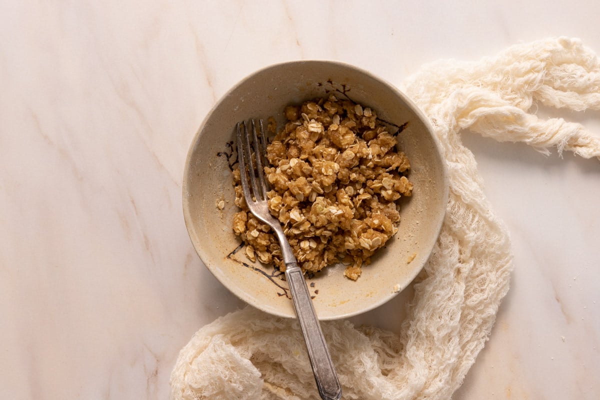 A crumble mixture for a peach crostata in a bowl