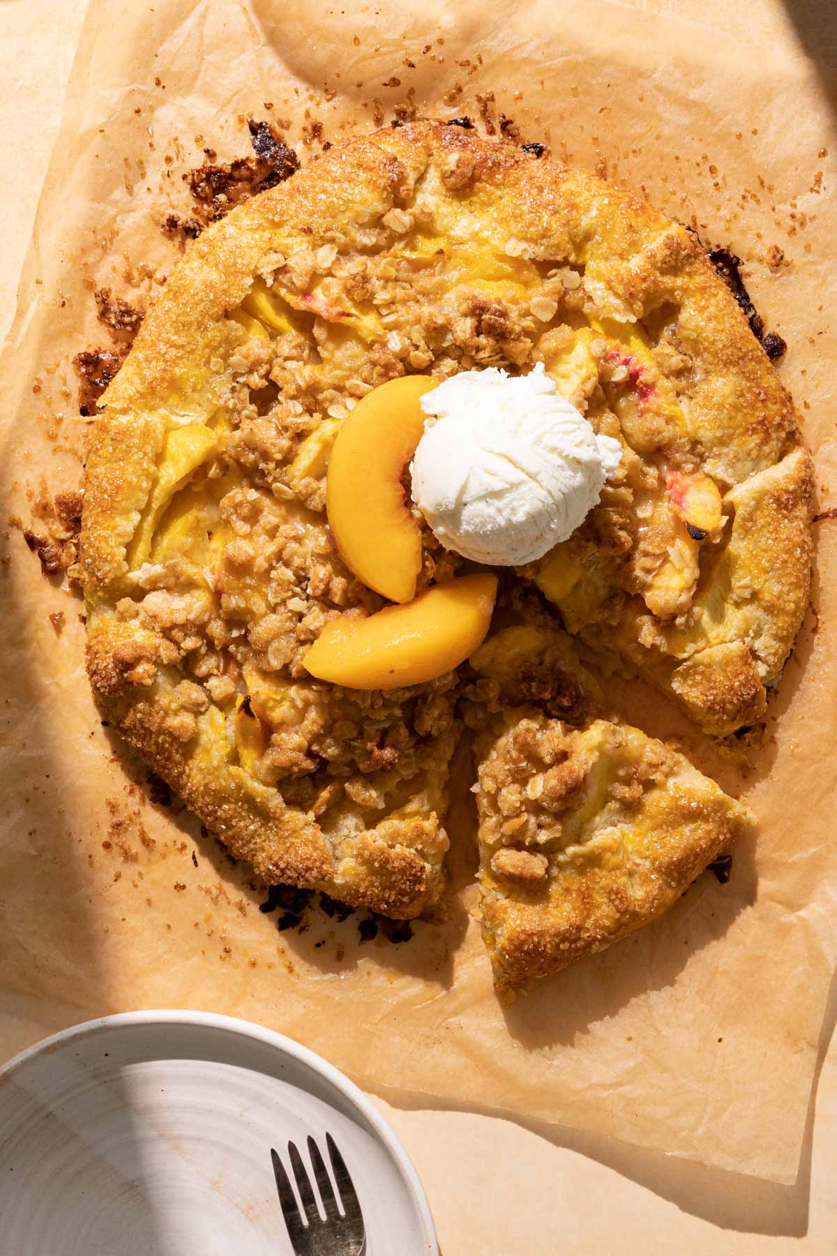 Peach crostata with a scoop of ice cream on top