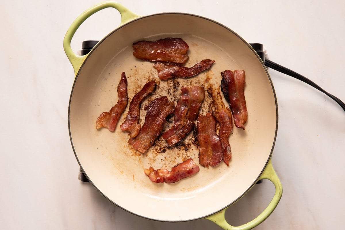 Bacon frying in a saute pan