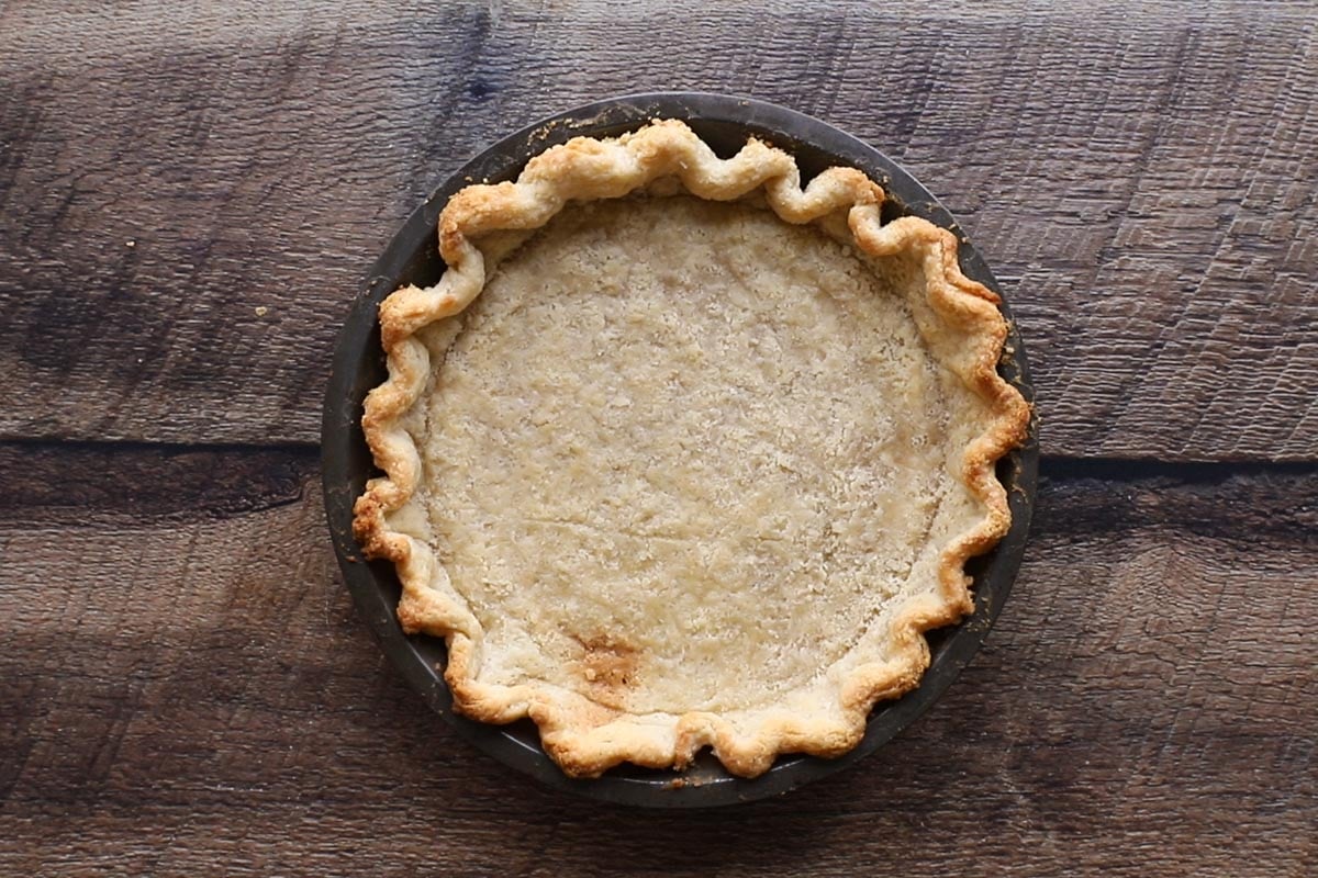 A partially baked pie crust