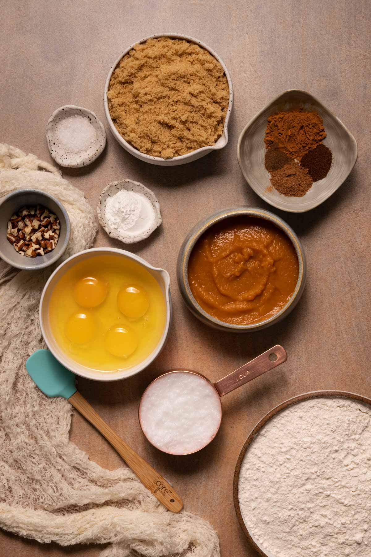 Ingredients for pumpkin muffins in bowls