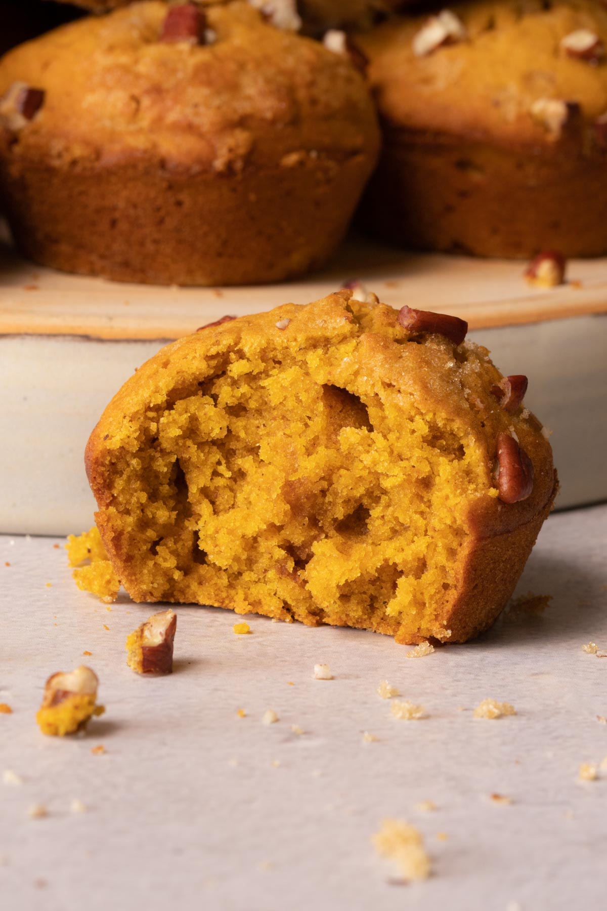 Pumpkin muffins up close with a bite taken out