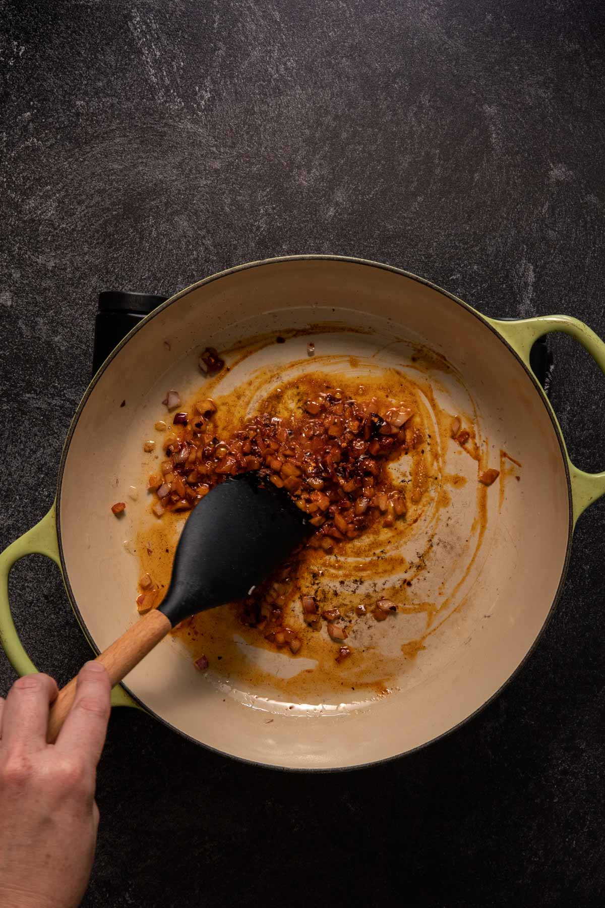 Red onion and spices in a saute pan