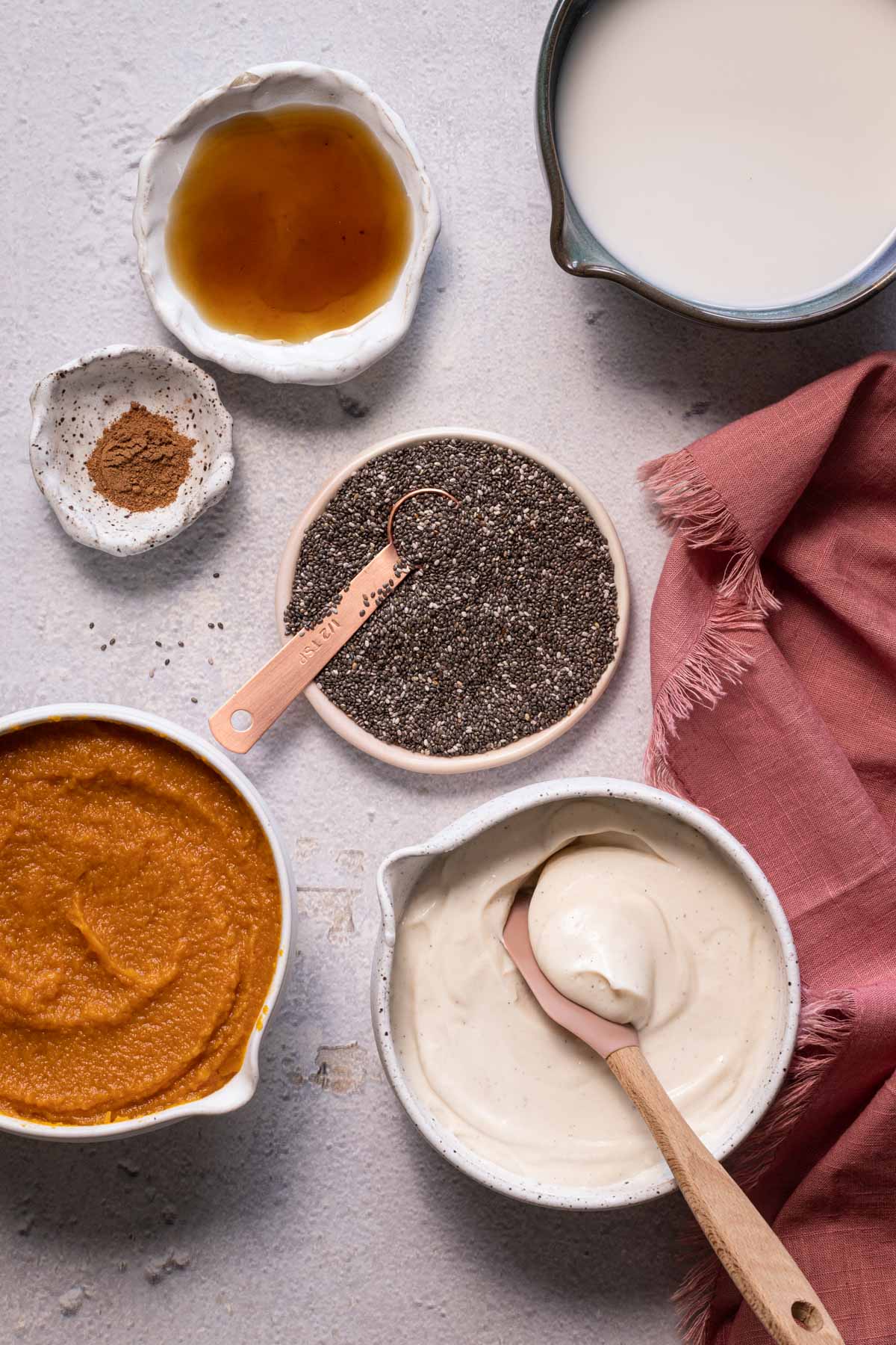 Ingredients for pumpkin chia pudding in bowls