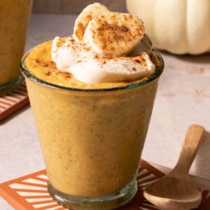 Pumpkin chia pudding in a glass with a spoon