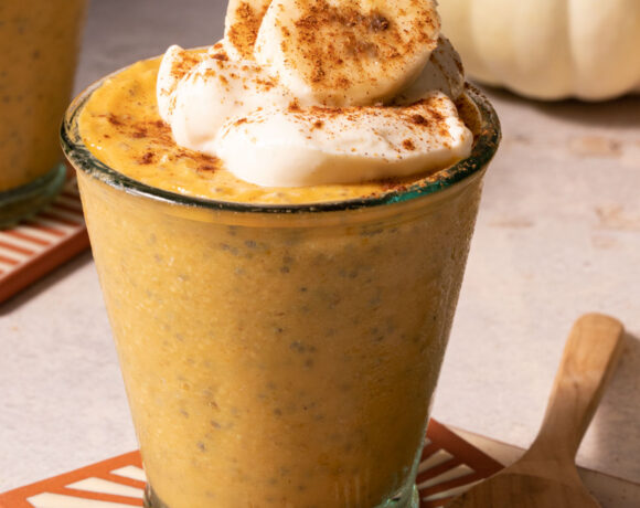 Pumpkin chia pudding in a glass with a spoon