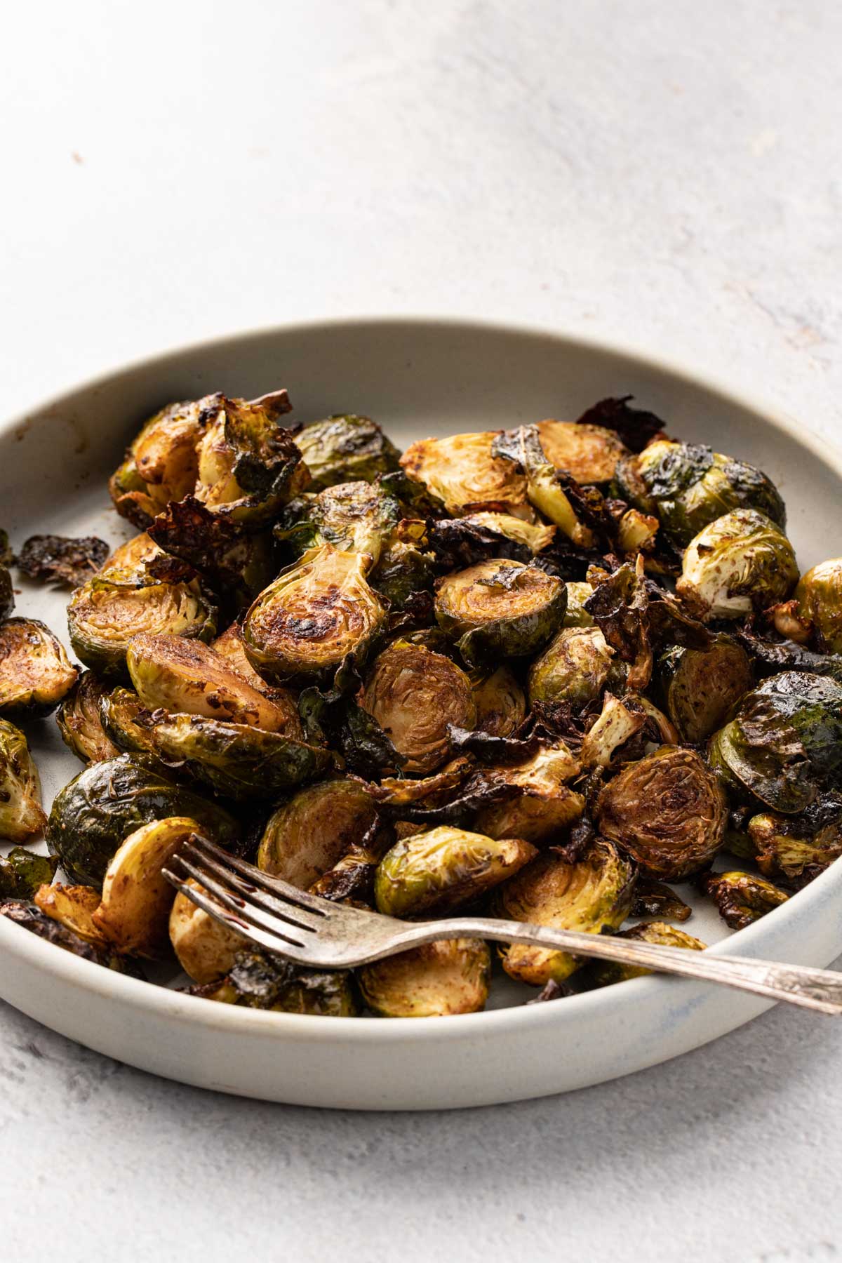 Crispy Baked Brussel sprouts on a plate with a fork