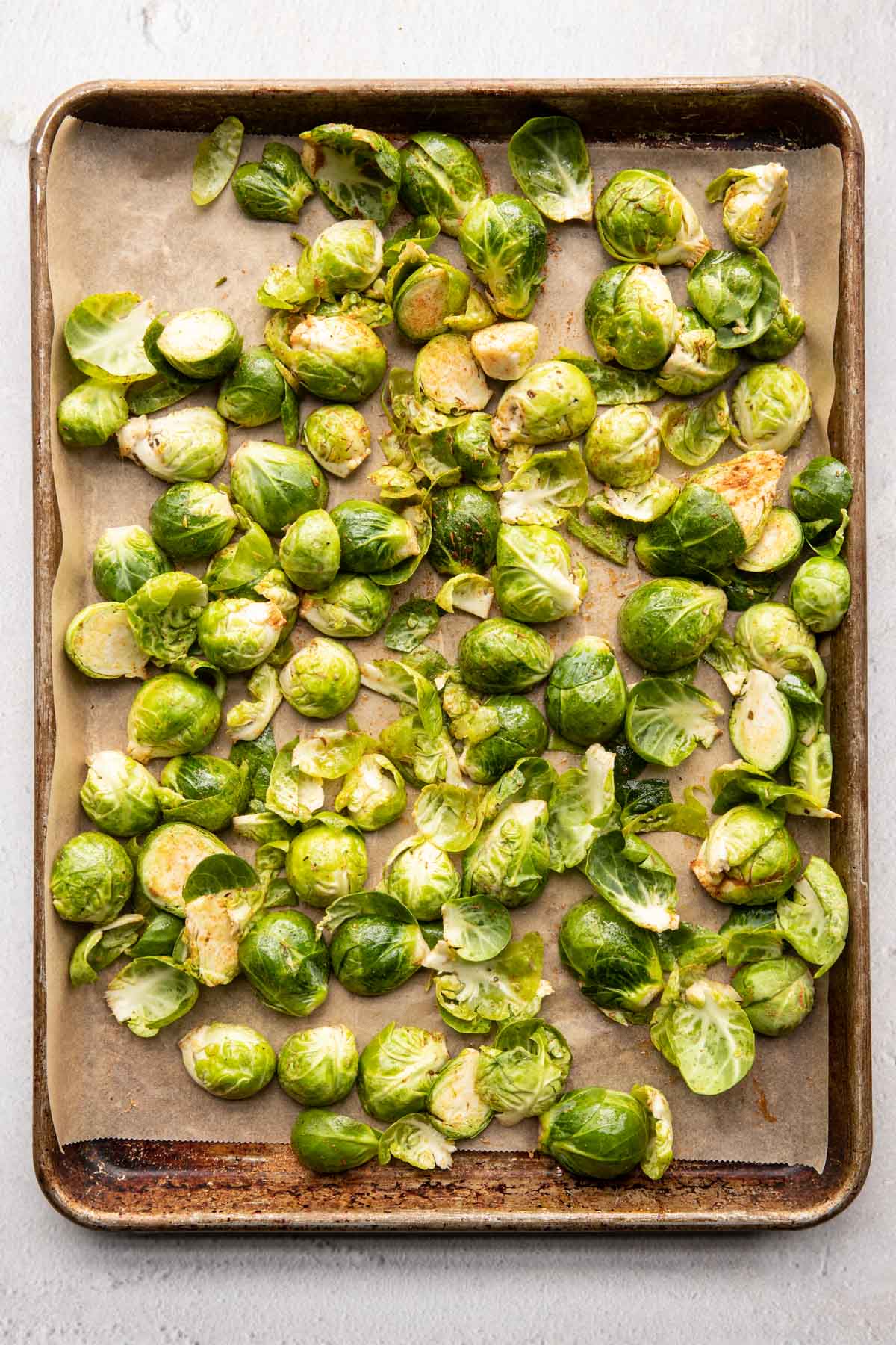 Seasoned brussel sprouts on a sheet pan