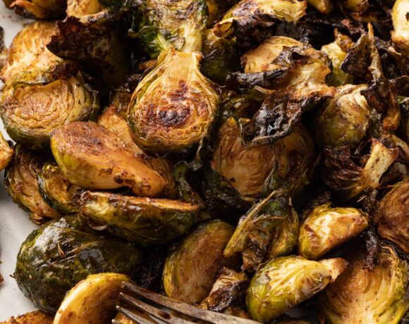 Crispy baked Brussel sprouts up close with a fork