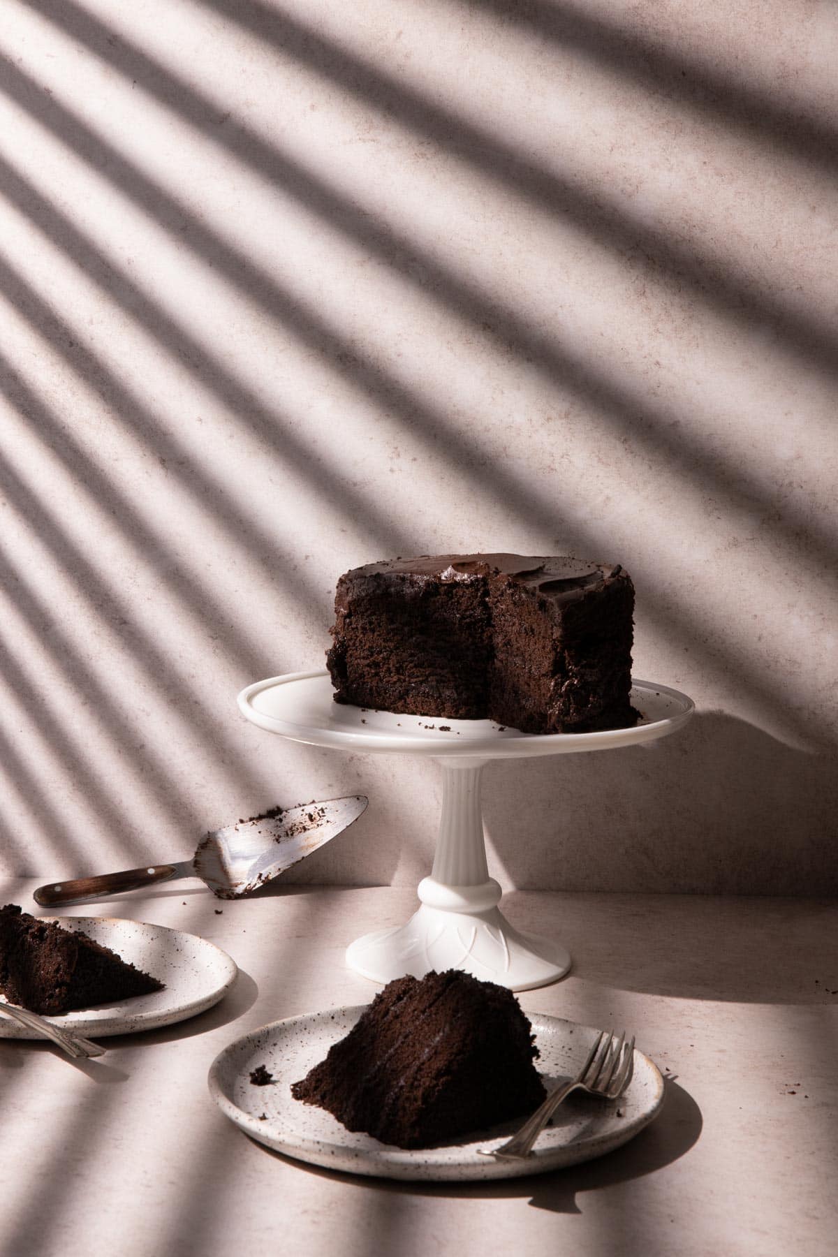 Chocolate cake with window blinds shadows