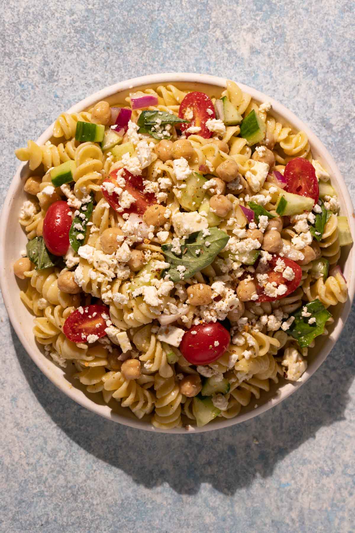 Lemon Basil Chickpea Pasta Salad on a round plate