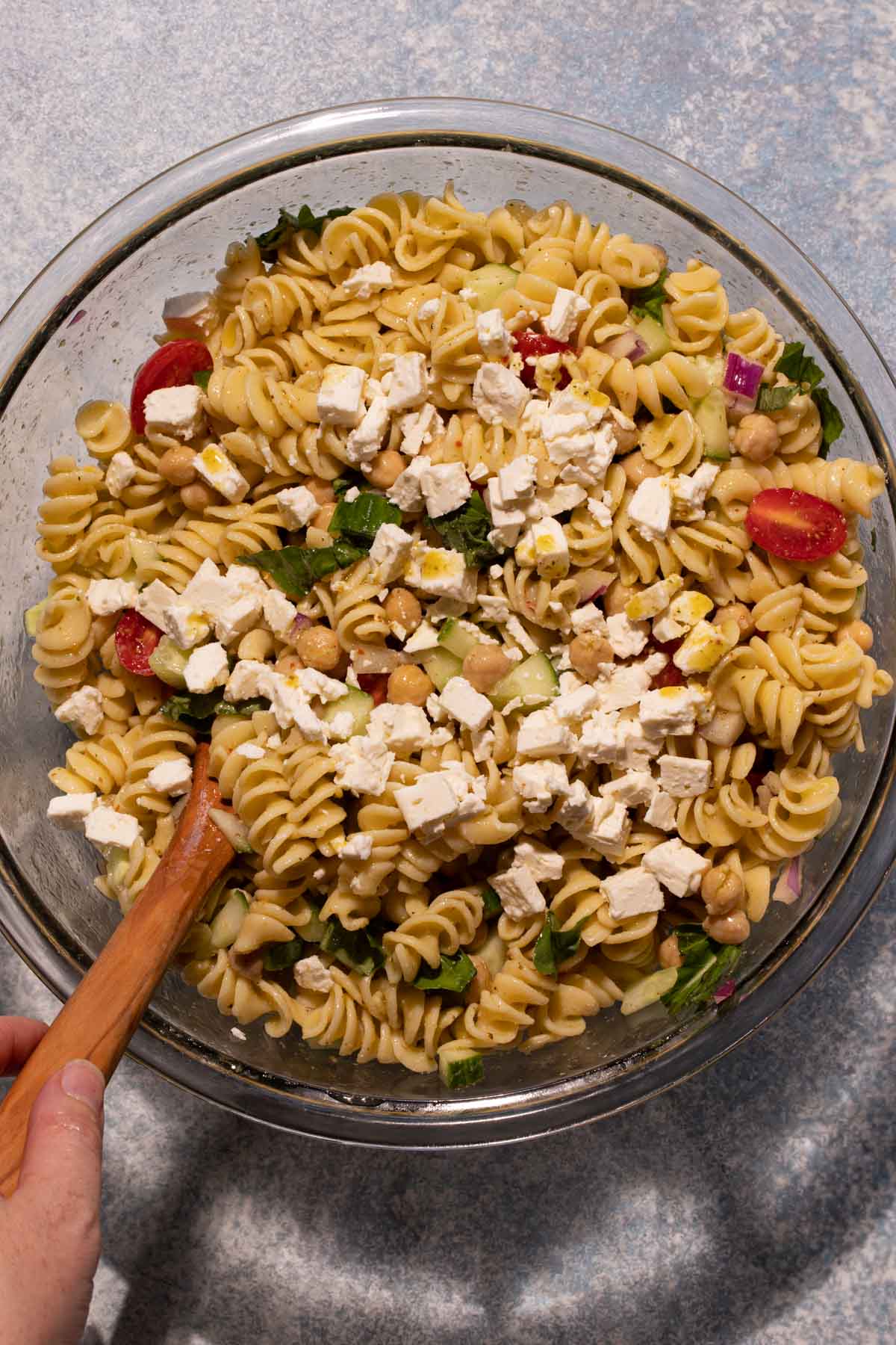 Lemon basil chickpea pasta salad with feta in a bowl