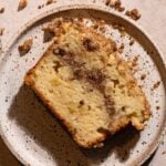 A slice of apple streusel cake on a plate