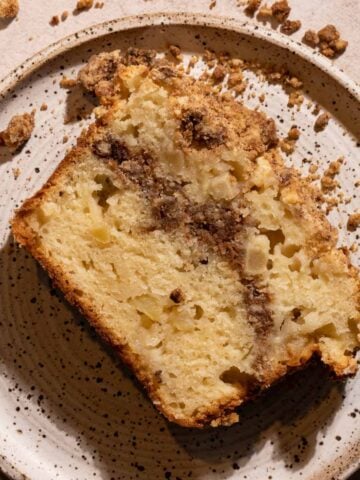 A slice of apple streusel cake on a plate