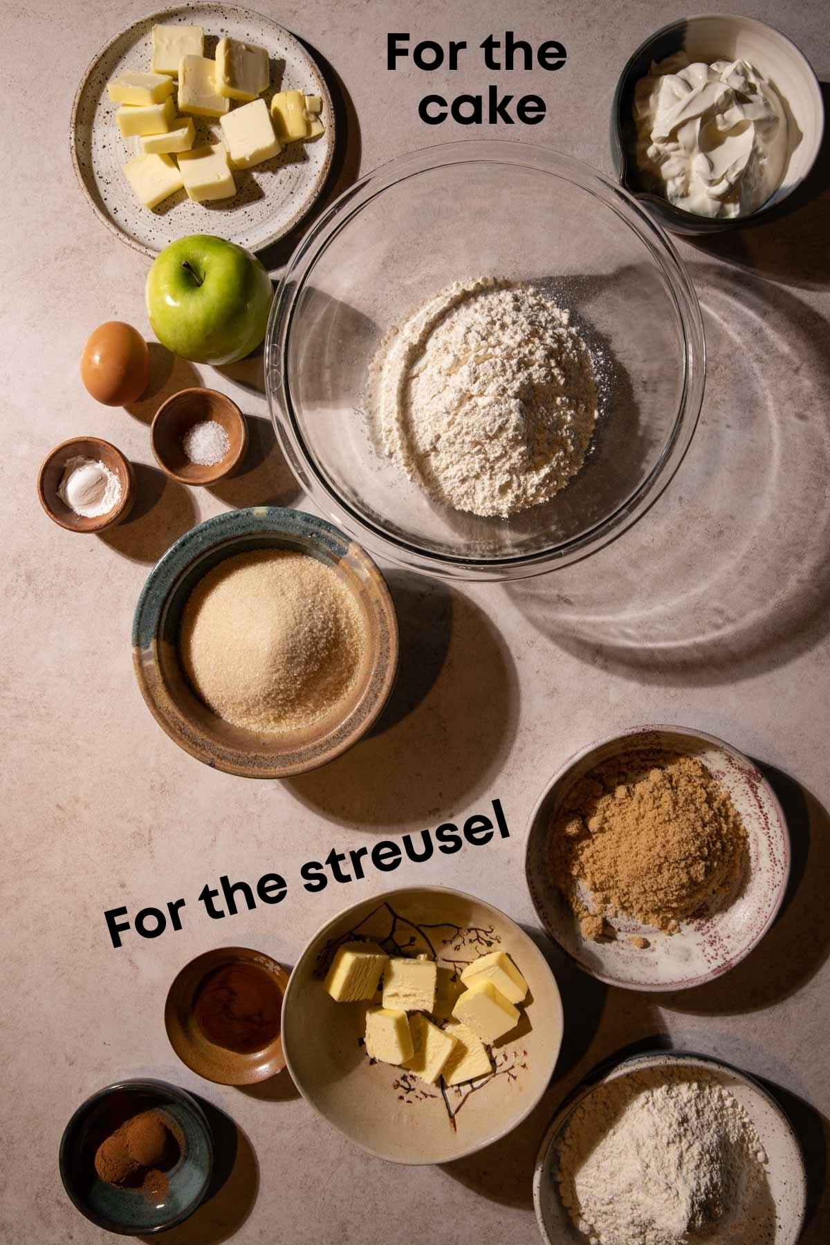 Bowls of ingredients for an apple streusel cake
