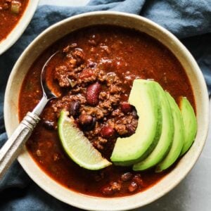 bone broth chili in a bowl with a lime slice