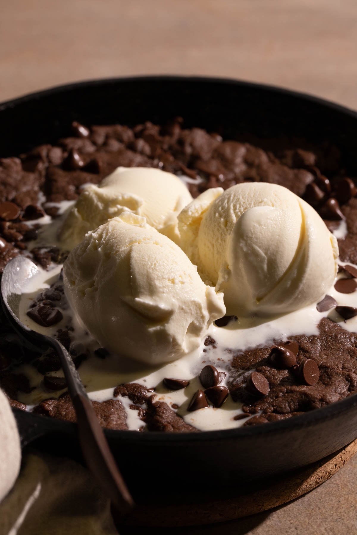 Double Chocolate Skillet Cookie with three ice cream scoops