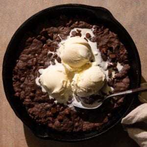 Double Chocolate Skillet Cookie with ice cream and a spoon