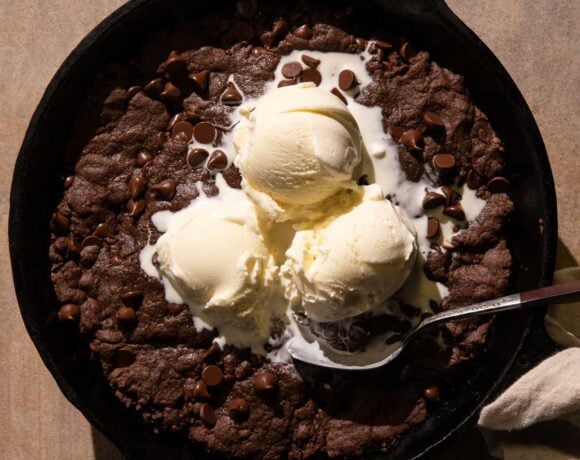 Double Chocolate Skillet Cookie with ice cream and a spoon