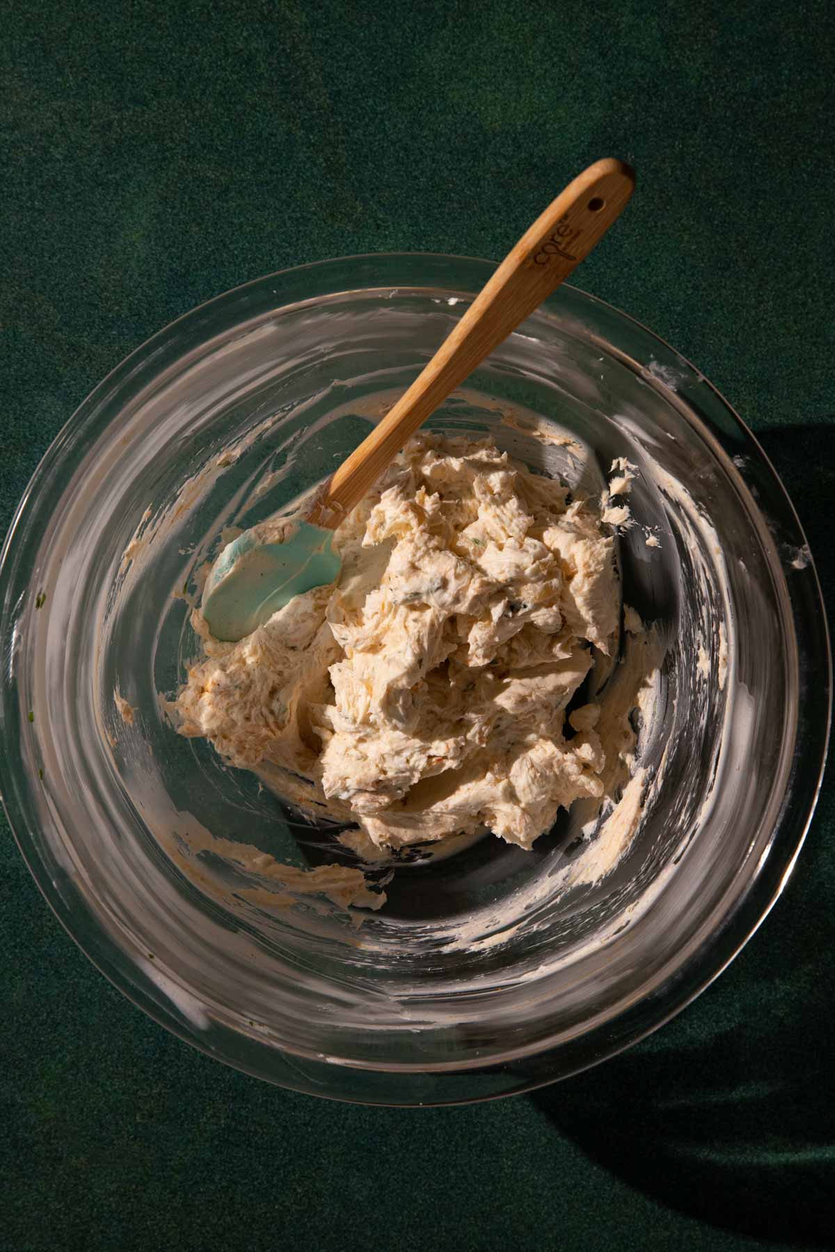 A mixing bowl with the creamy goat cheese dip mixed up to bake.