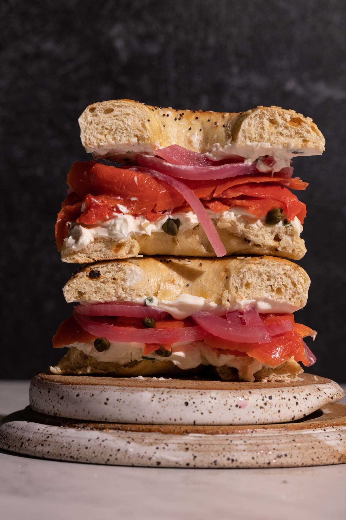 Smoked salmon bagels stacked with pickled red onions